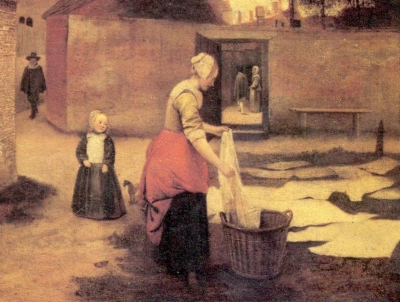 laying white laundry on grass in town of Delft